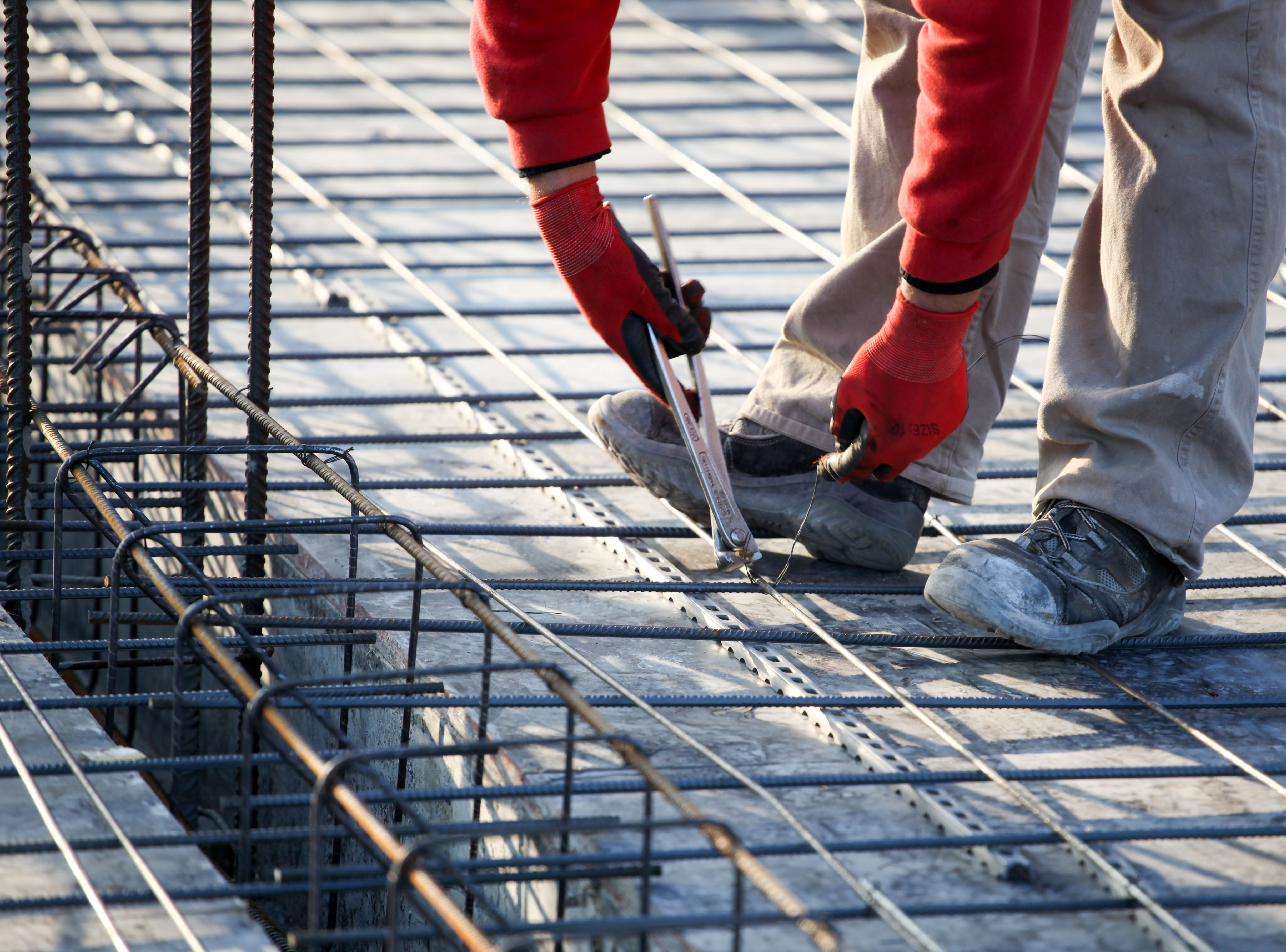workers make reinforcement for concrete foundation workers make reinforcement for concrete foundation
